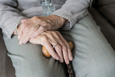 Elderly person hands in lap